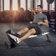 Pivoting footplates with safety straps on the adjustable folding magnetic rowing machine for secure rowing workouts.